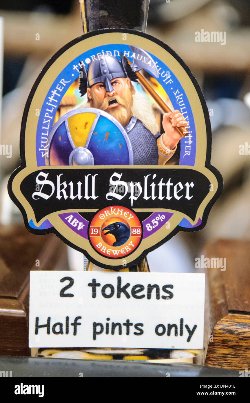 Skull Splitter strong ale from Orkney, at a real ale festival, with a sign saying '2 tokens. Half pints only' Stock Photo