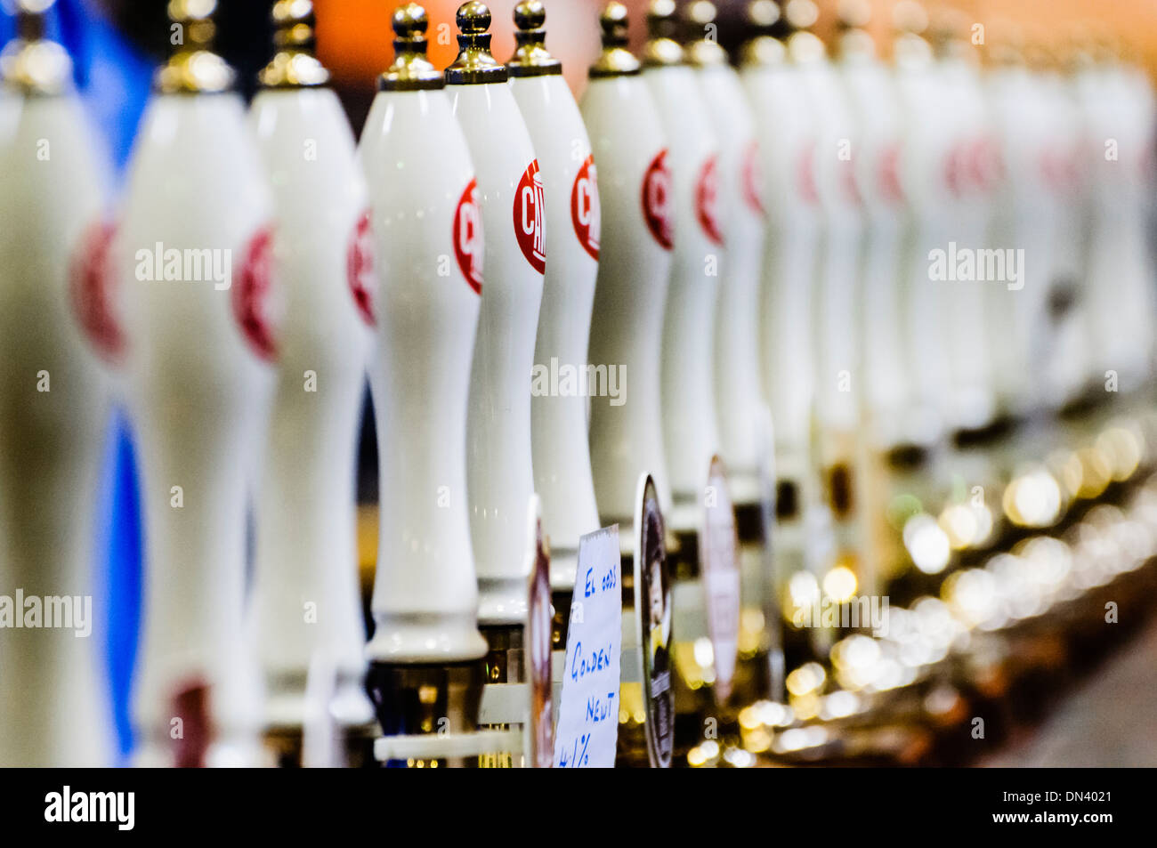 Row of many CAMRA beer pumps at a real ale, beer and cider festival Stock Photo