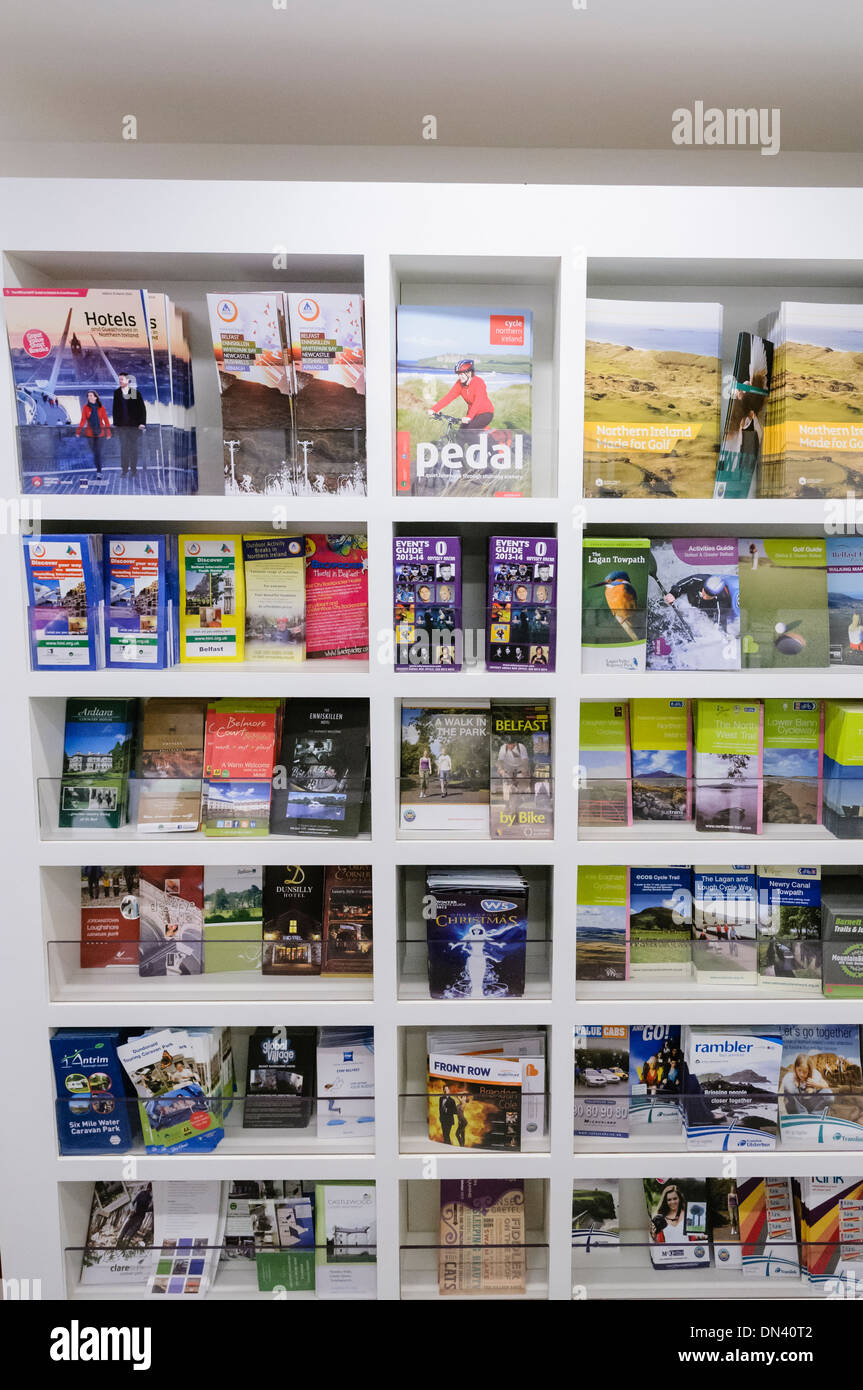 Tourist information leaflets on shelves in Visit Belfast tourist information centre Stock Photo