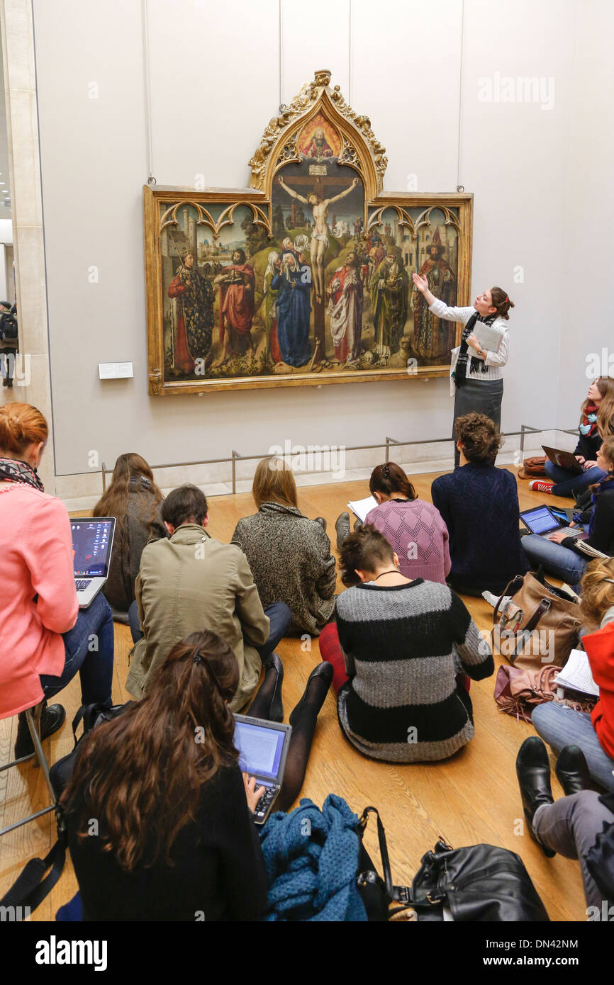 French students listening to guide, Louvre Museum, Paris, France Stock Photo