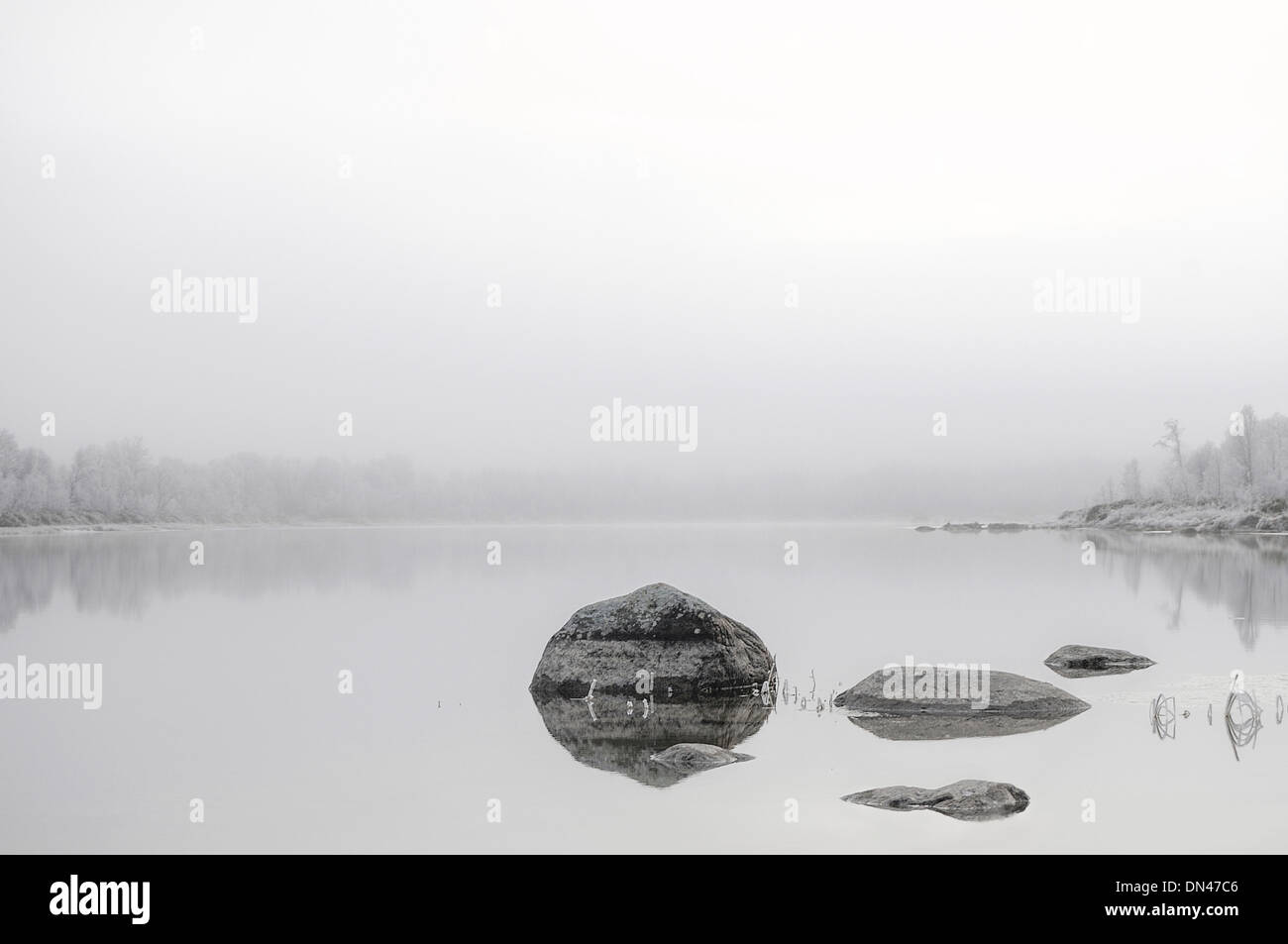 A high key, misty, scenic view of the river Glomma, Norway in wintertime Stock Photo