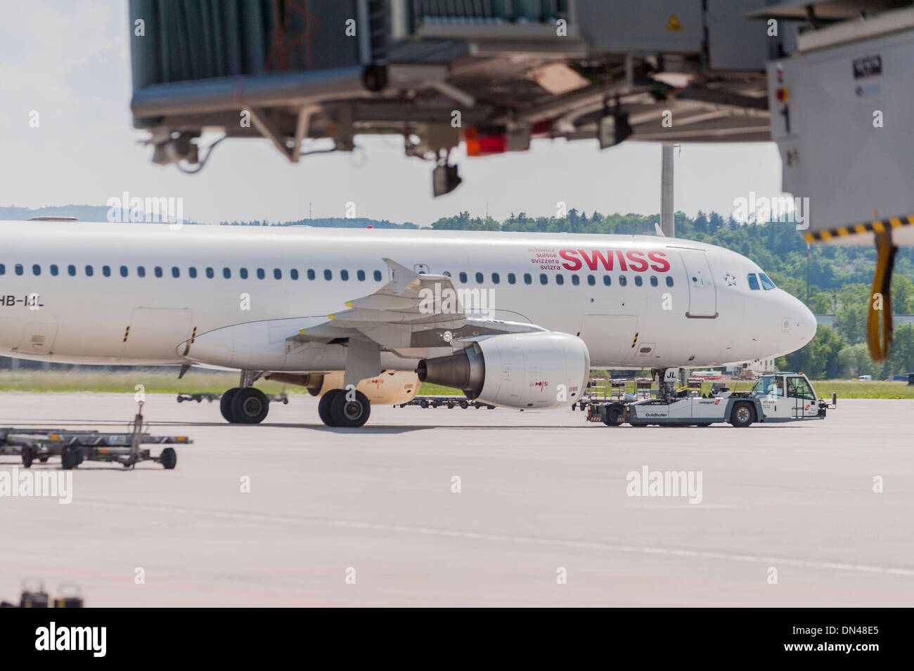 An Airbus aircraft of Swiss International Airlines is pulled to the runway at Zurich international airport Stock Photo