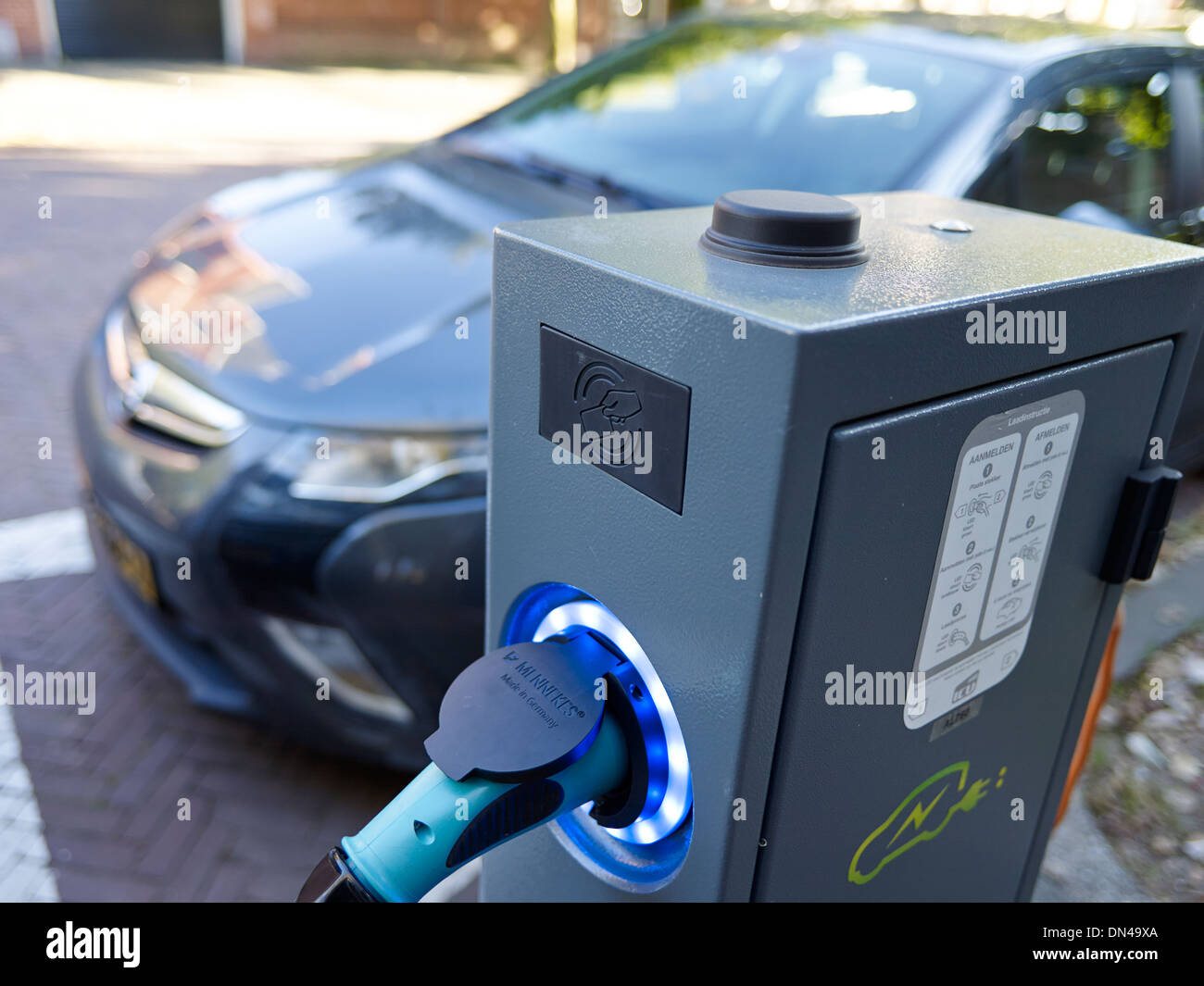 Electric car charging point on the street Stock Photo