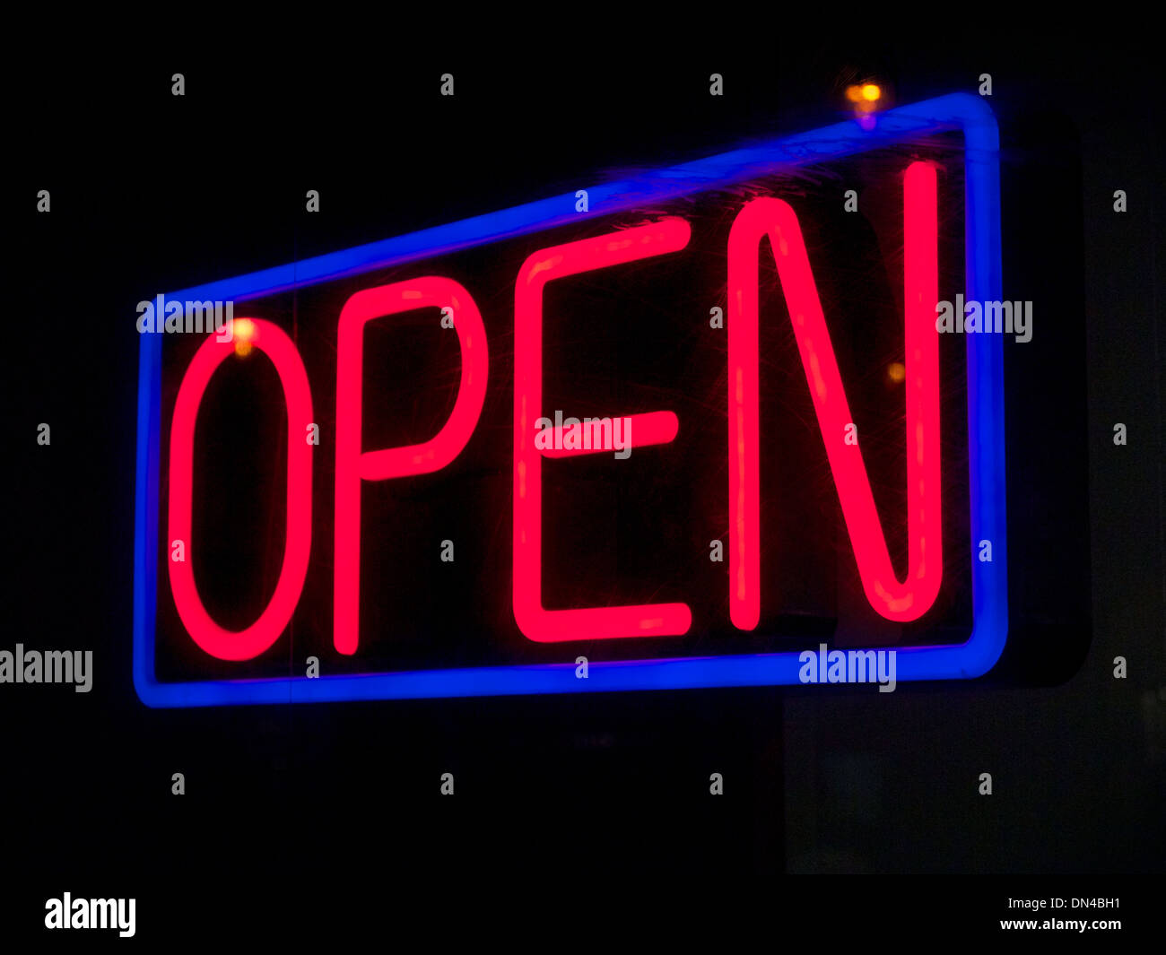 Neon open shop sign red blue black Stock Photo