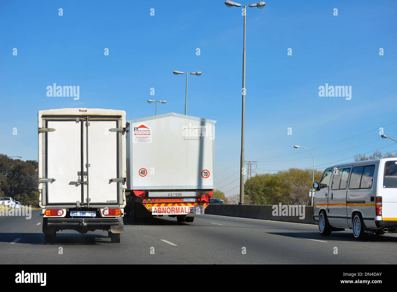 Traffic driving along a motorway in Johannesburg in South Africa. Stock Photo