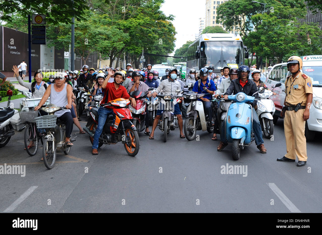Vietnamese Motorcycle Rider Vietnamese Motorbike Riders Pause as Secretary Kerry Crosses Street ...