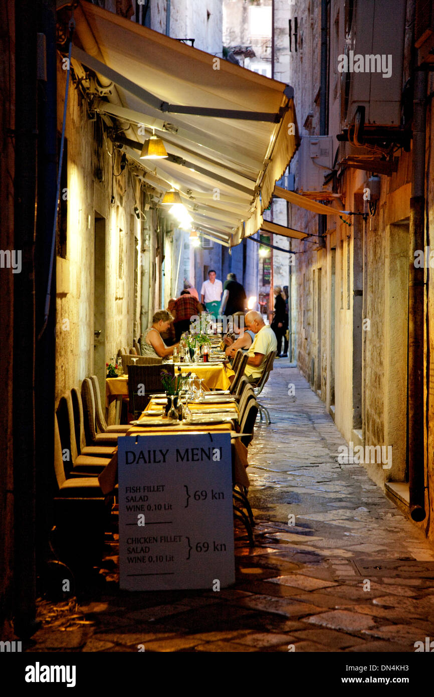 Dubrovnik, Croatia. Night scene in the old town with tourists eating in a resturant Stock Photo