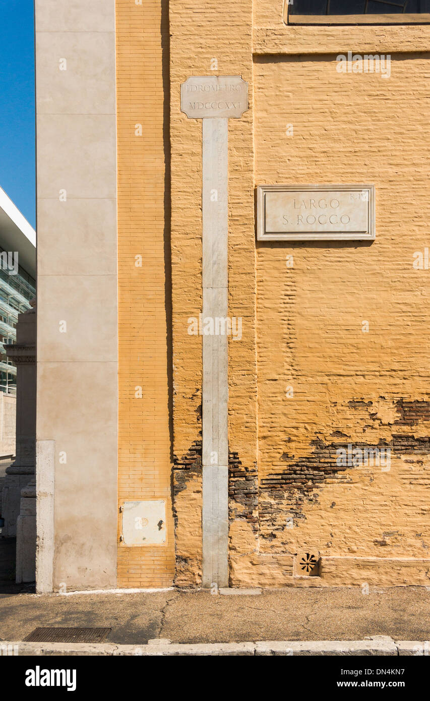 A flood level sign for the Tiber river, along a wall of the San Rocco church, 1821, Rome, Italy. Stock Photo