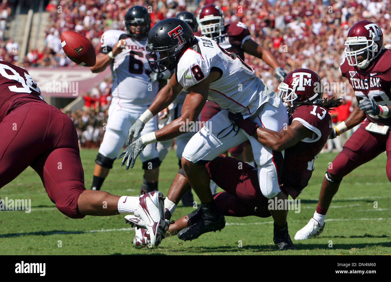 Sep 30, 2006; College Station, TX, USA; NCAA Football: Texas Tech's JOEL FILANI fumbles the ball as he is tackled by Texas A&M's MARQUIS CARPENTER Saturday Sept. 30, 2006 at Kyle Field in College Station.  Mandatory Credit: Photo by E.A. Ornelas/San Antonio Express-News/ZUMA Press. (©) Copyright 2006 by San Antonio Express-News Stock Photo