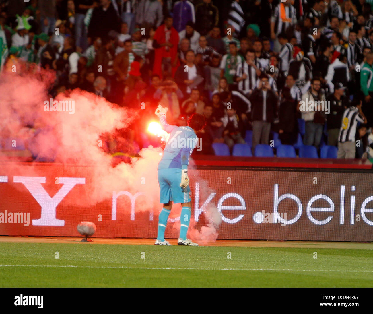 Marrakech , Morocco. 18th Dec, 2013. the goalkeeper Sherif EKRAMY throws a firework off the pitch during the FIFA Club World Cup 5th Place game between Al Ahly SC and CF Monterrey from the Marrakech Stadium. Credit:  Action Plus Sports/Alamy Live News Stock Photo