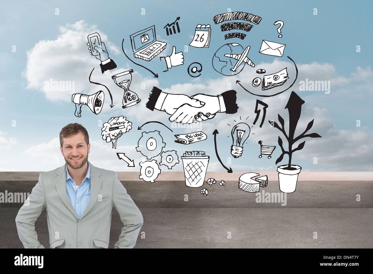 Composite image of stylish man smiling with hands on hips Stock Photo