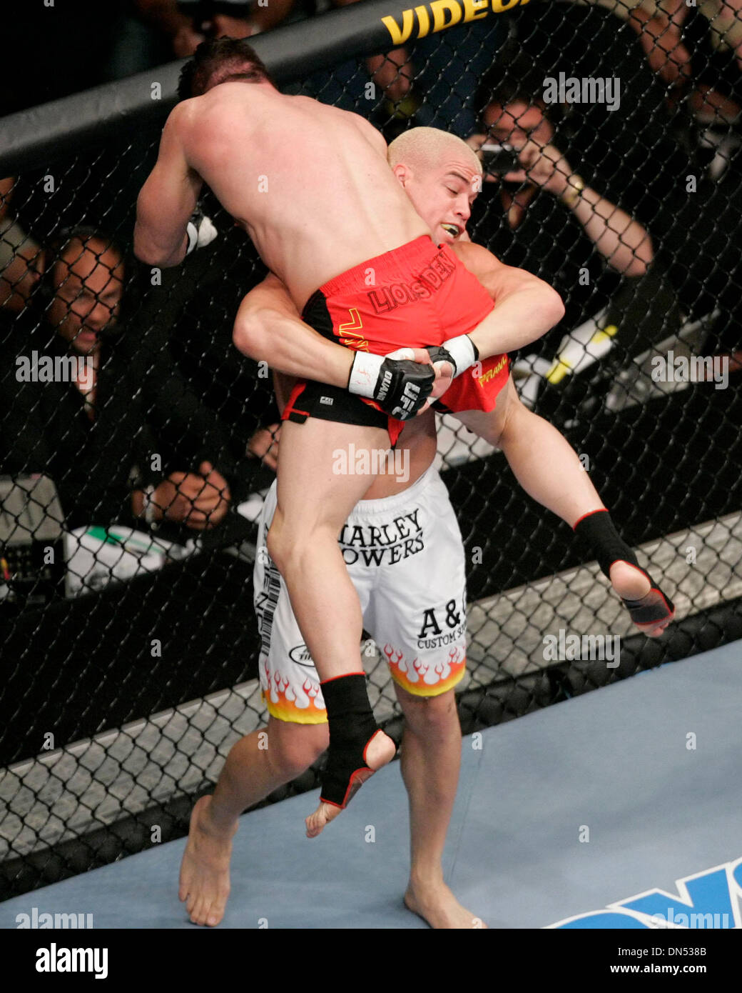 July 8, 2006Tito Ortiz picks up Ken Shamrock for a slam at UFC 61 at