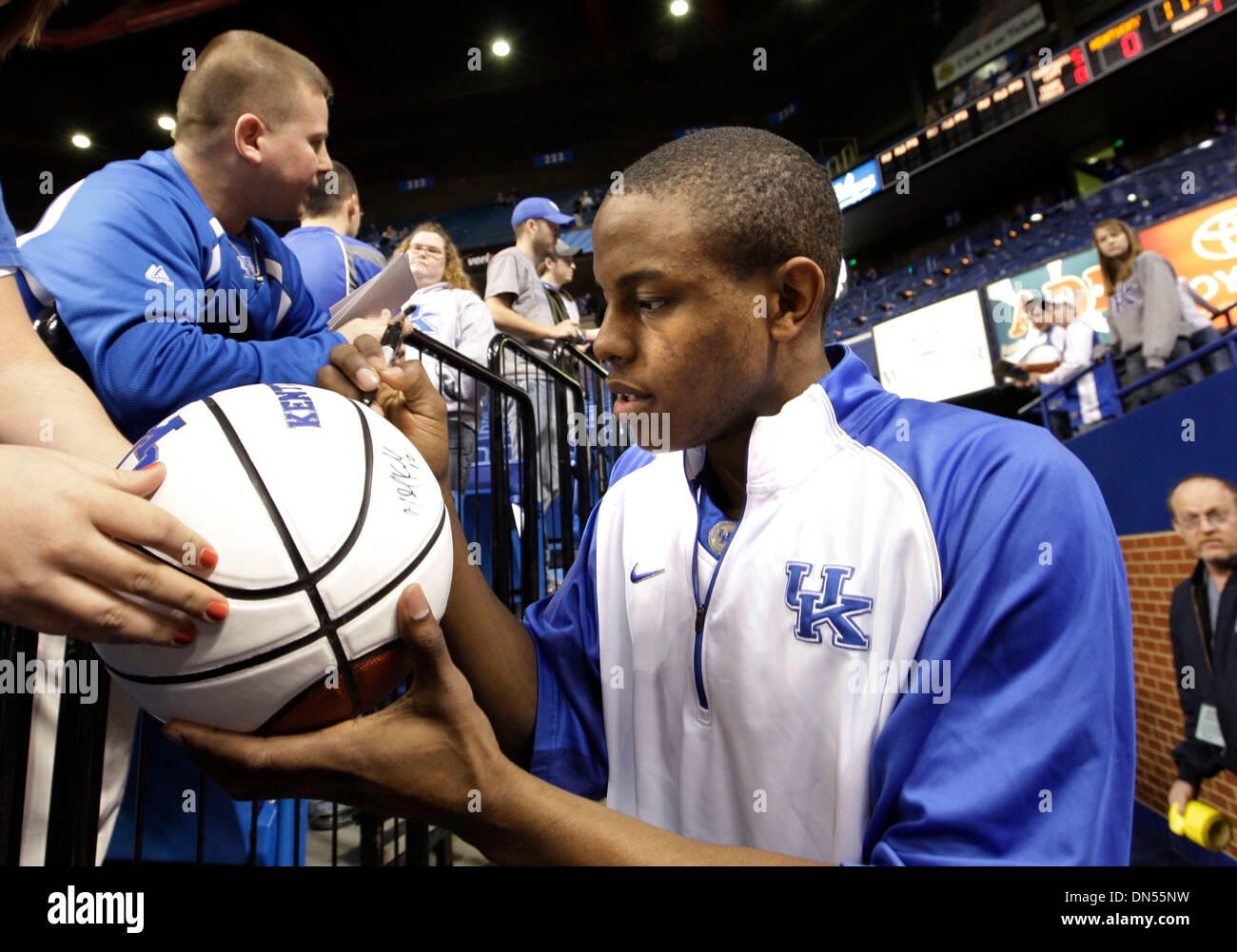 UK's Darius Miller signed autographs before the team warmed up before the University of Kentucky