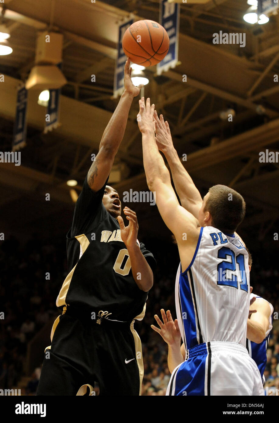 Feb 22, 2009 - Durham, North Carolina, USA - NCAA Basketball - Wake Forest's JEFF TEAGUE (0) puts up a shot over Duke's Miles Plumlee (21) in the first half of the game between the Wake Forest Demon Deacons and the Duke Blue Devils at Cameron Indoor Stadium in Durham, N.C., on Sunday February 22, 2009. Duke won the game 101-91.  (Credit Image: © Steve Dykes/ZUMA Press) Stock Photo