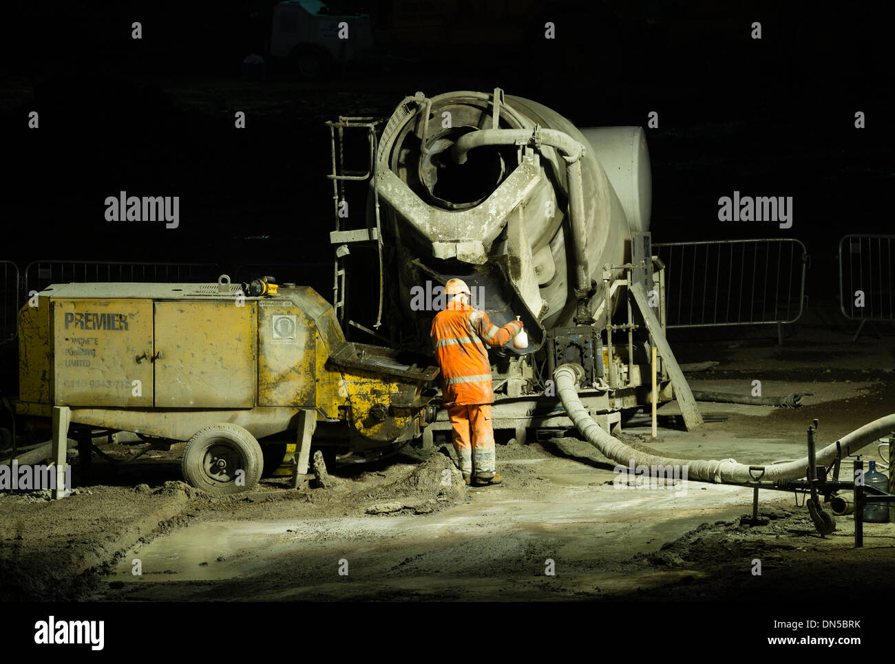 Cement Mixer on building site at night. UK Stock Photo Alamy