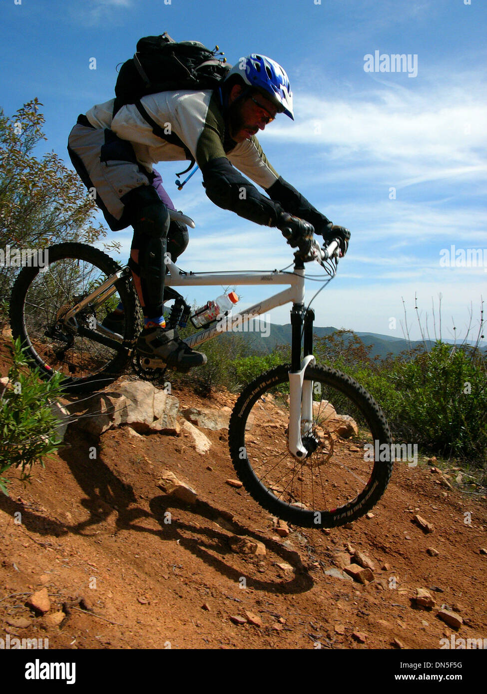 Sep 23, 2006; San Juan, CA, USA; Mountain biking is roughly broken down into five categories: cross country, downhill, Freeride, Dirt Jump and trials/street riding. However, most mountain bikes have a similar look: knobby tires, large round frame tubing, and some sort of suspension or shock absorbers are the usual pieces of equipment. The sport requires endurance, bike handling ski Stock Photo