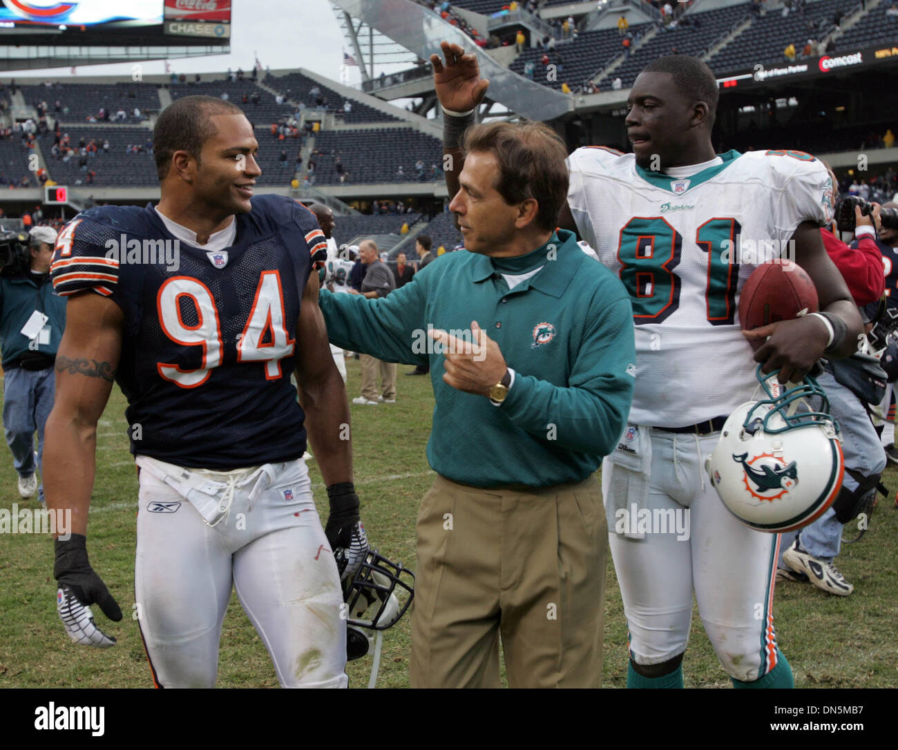 Nov 05, 2006; Chicago, IL, USA; Miami Dolphinns at Chicago Bears NFL  football game. Bears #94 Brendon Ayanbadejo talks with Nick Saban and Randy  McMichael after the game. Mandatory Credit: Photo by