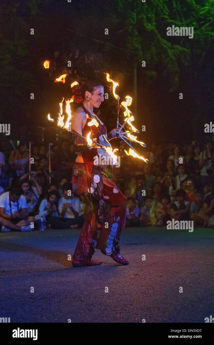 Israeli fire dancer performing at the Street Show in Bangkok, Thailand Stock Photo