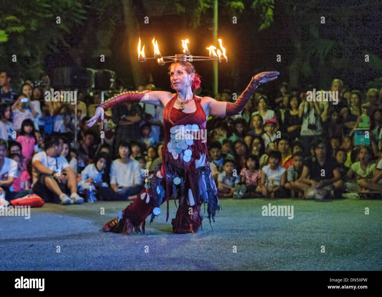 Israeli fire dancer performing at the Street Show in Bangkok, Thailand Stock Photo