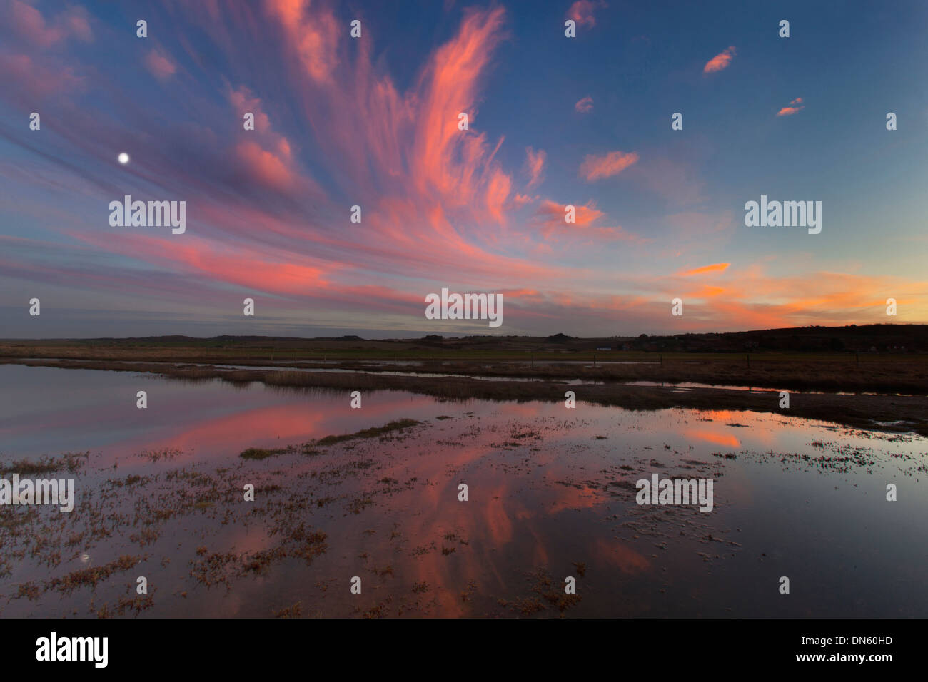 Moonrise and sunset at Salthouse Beach Norfolk Stock Photo - Alamy