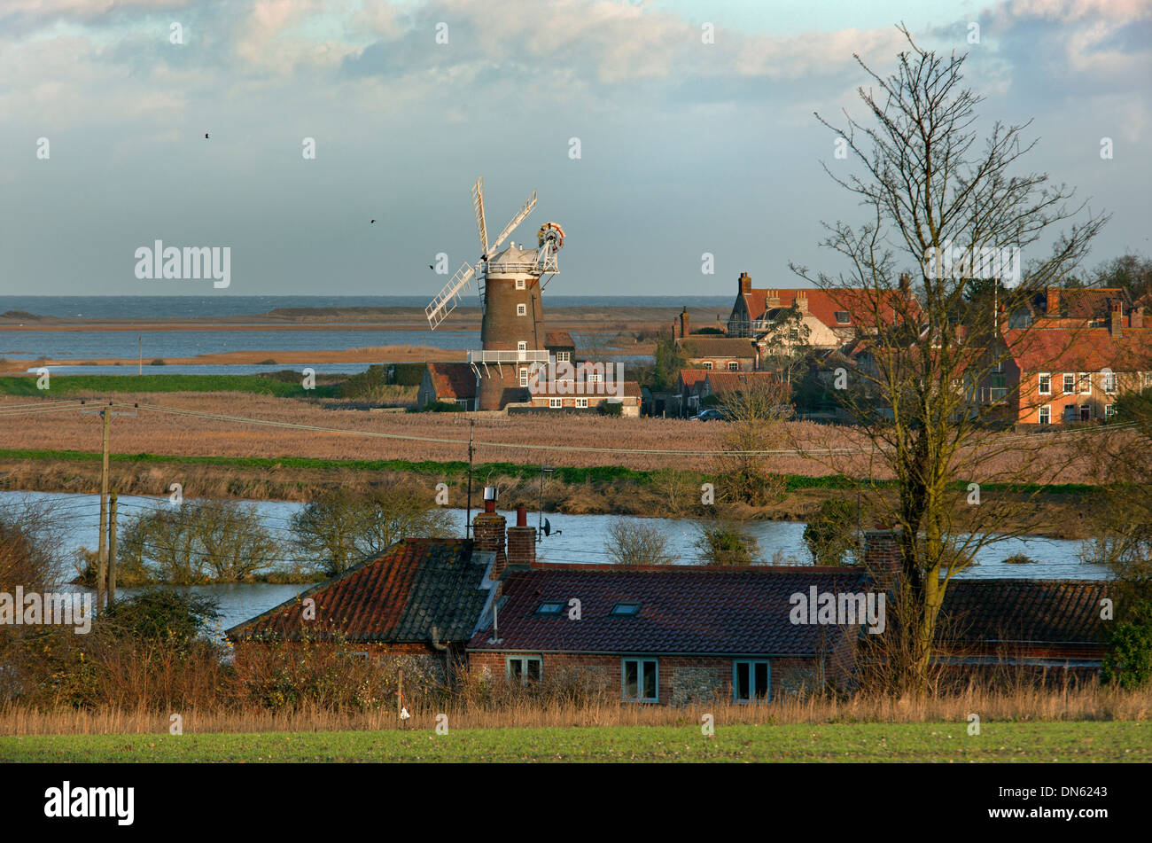 Cley village windmill and marshes flooded after tidal surge North Norfolk Stock Photo