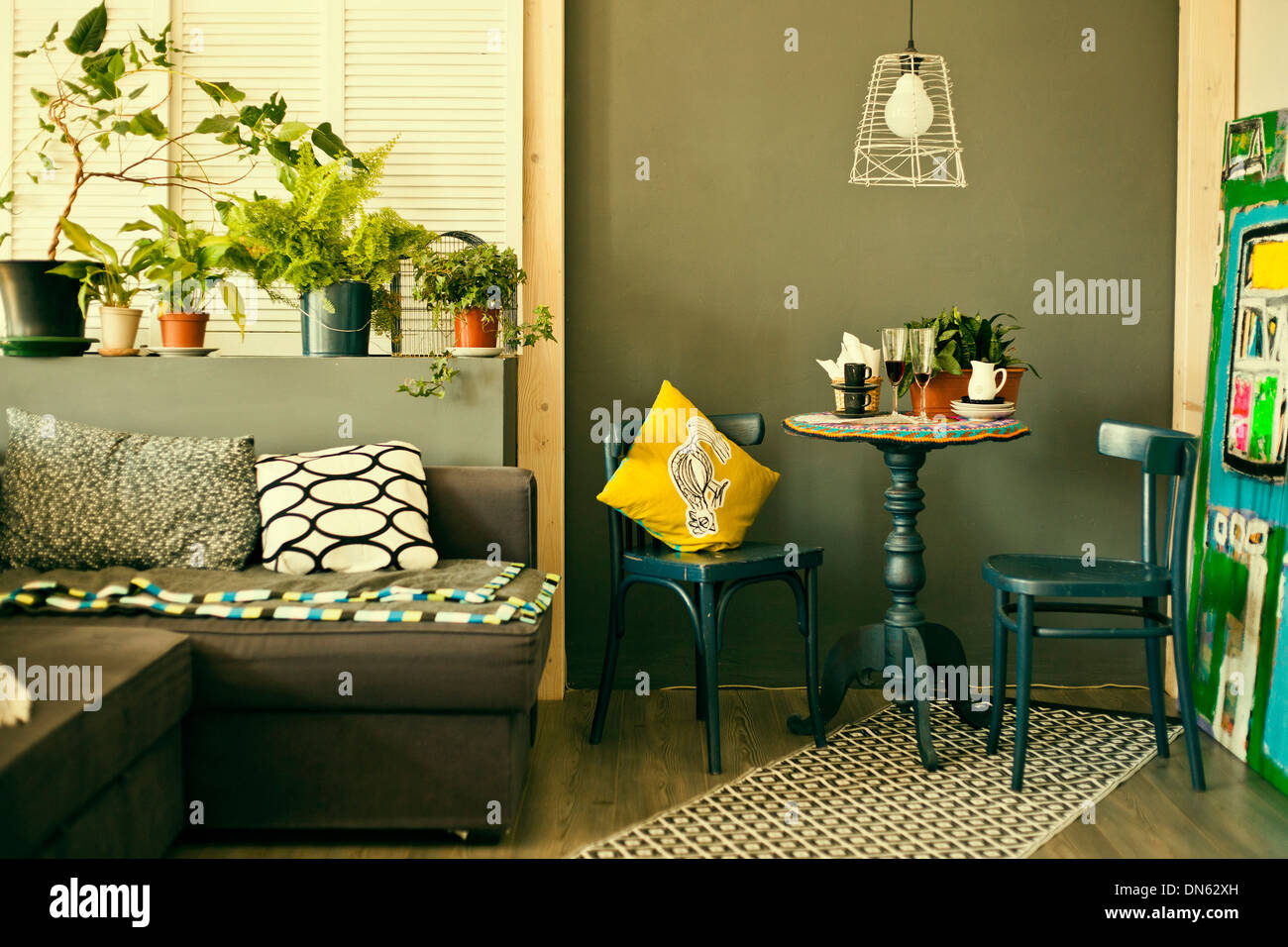 Table, chairs and sofa in modern living room Stock Photo - Alamy