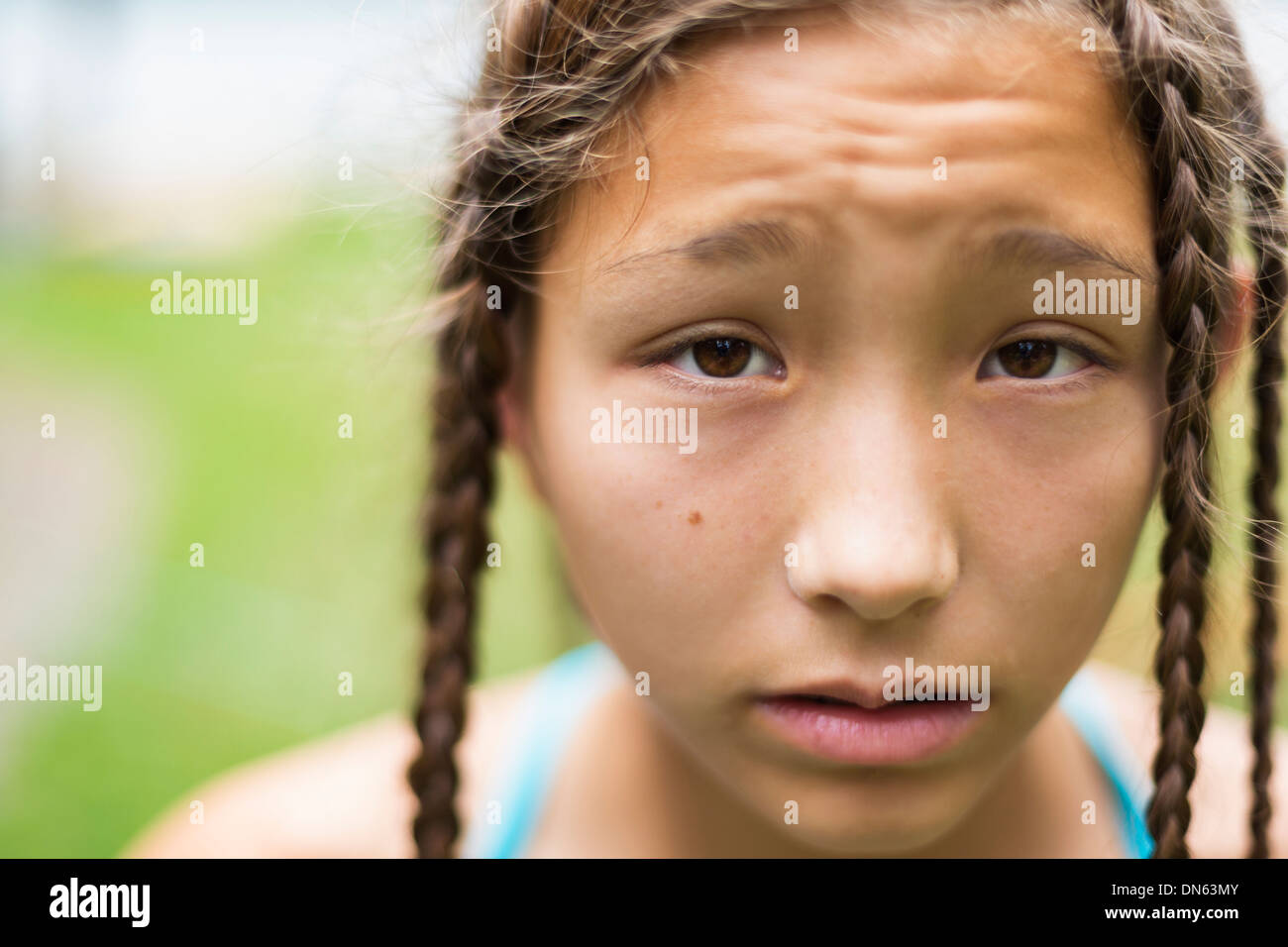 Mixed race girl with braids Stock Photo