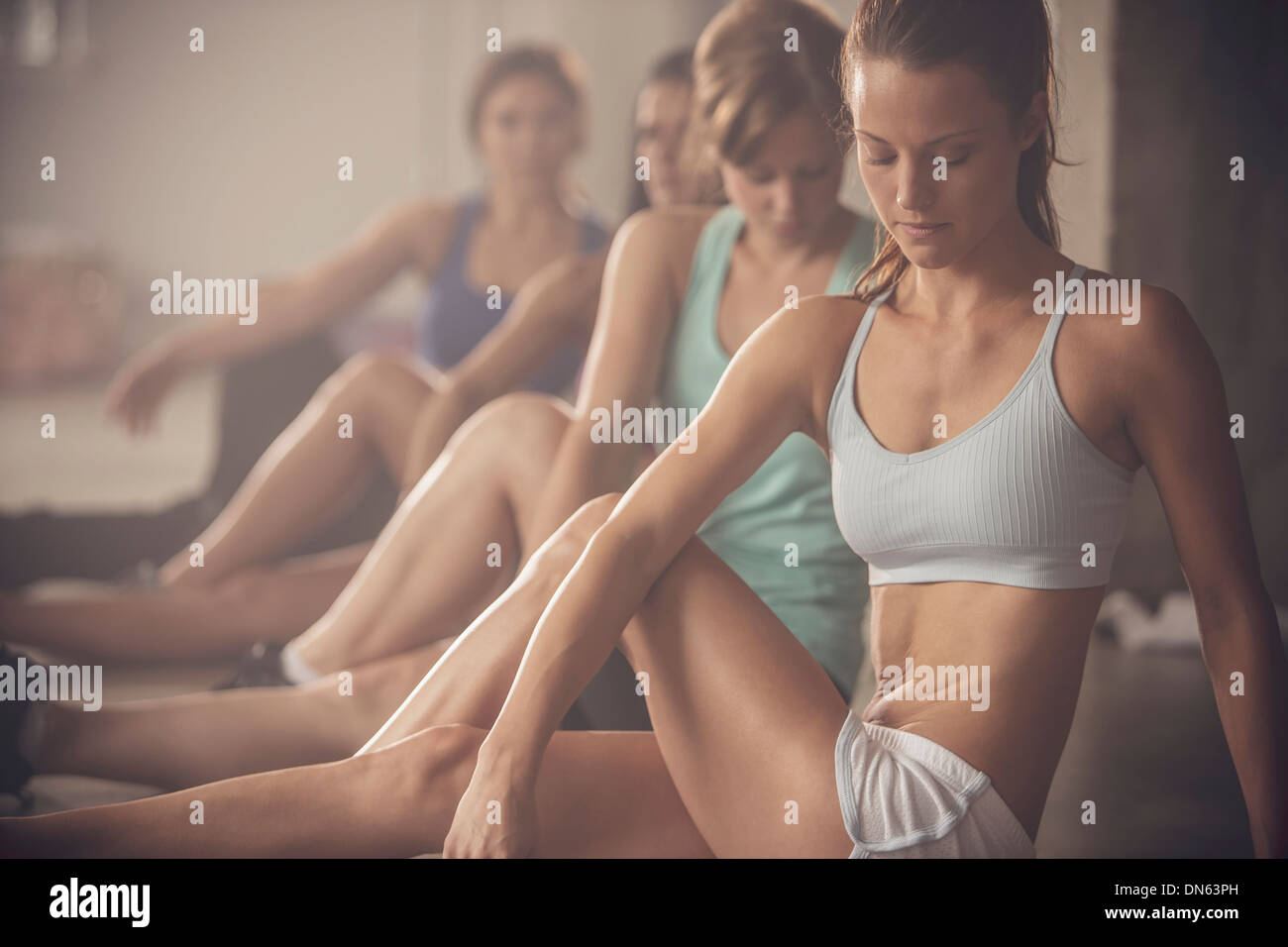 Women stretching in gym Stock Photo