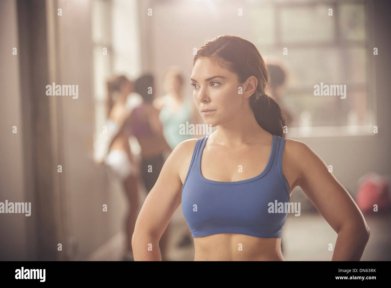 Woman standing in gym Stock Photo - Alamy