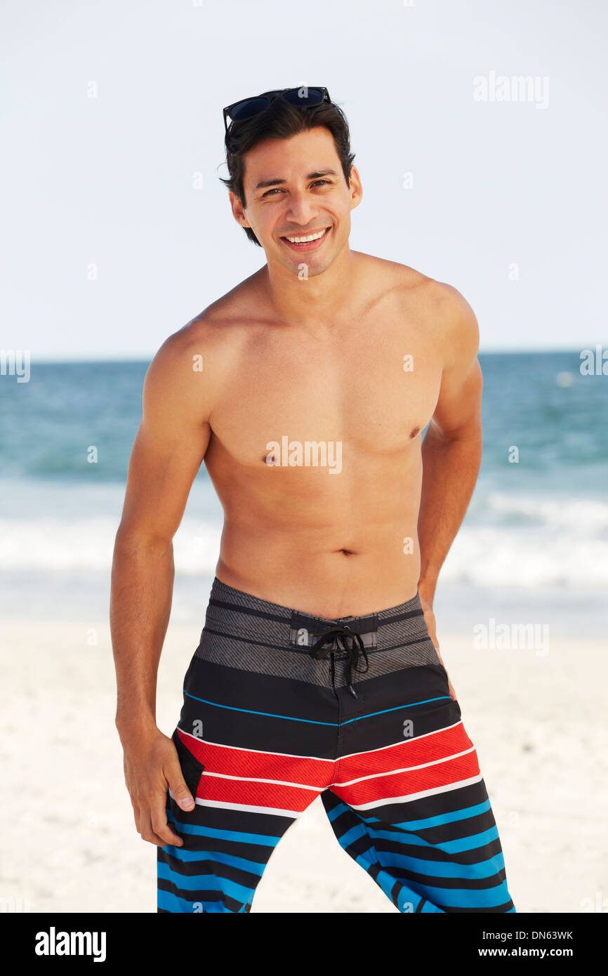 Man smiling on beach Stock Photo