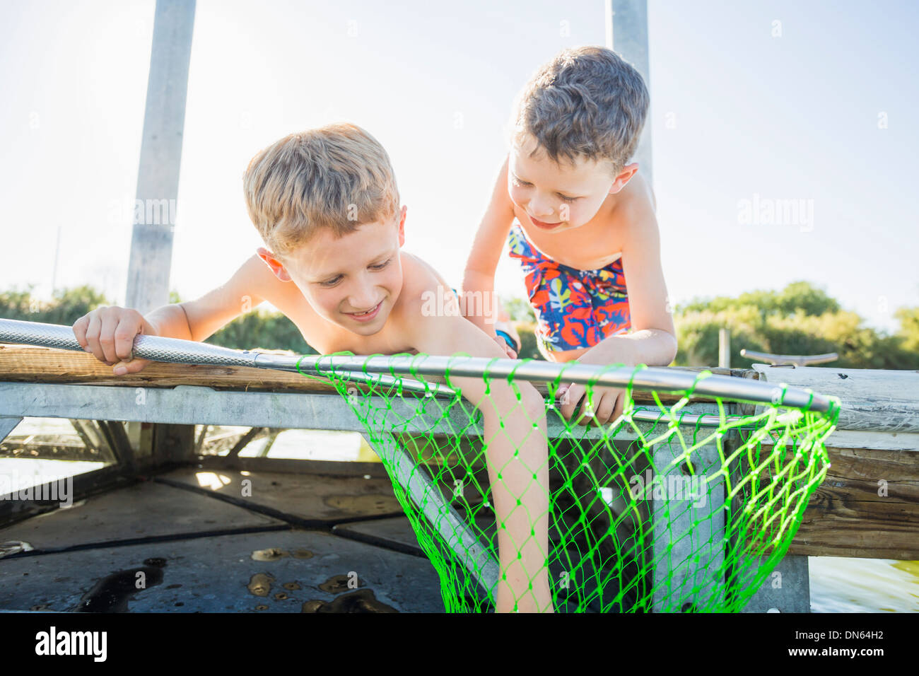 Two boys fishing at dock hi-res stock photography and images - Alamy