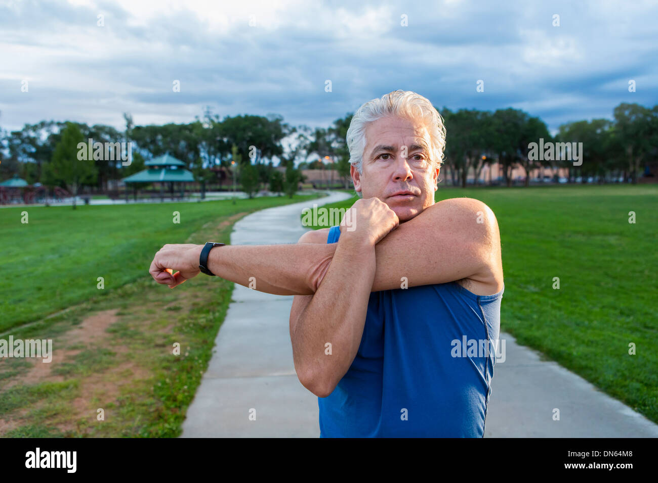 Hispanic man stretching arm hi-res stock photography and images - Alamy