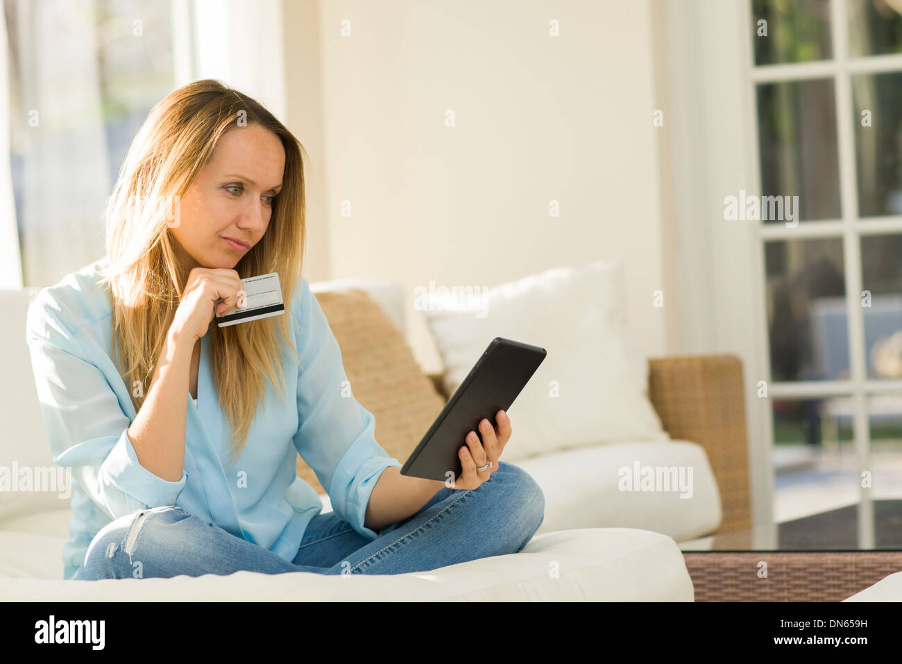 Caucasian woman shopping online with digital tablet Stock Photo
