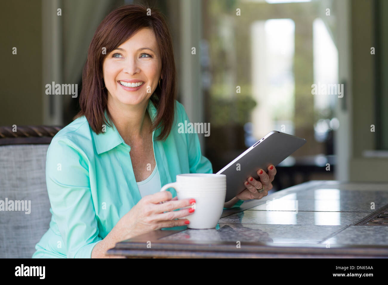 Caucasian woman using digital tablet Stock Photo