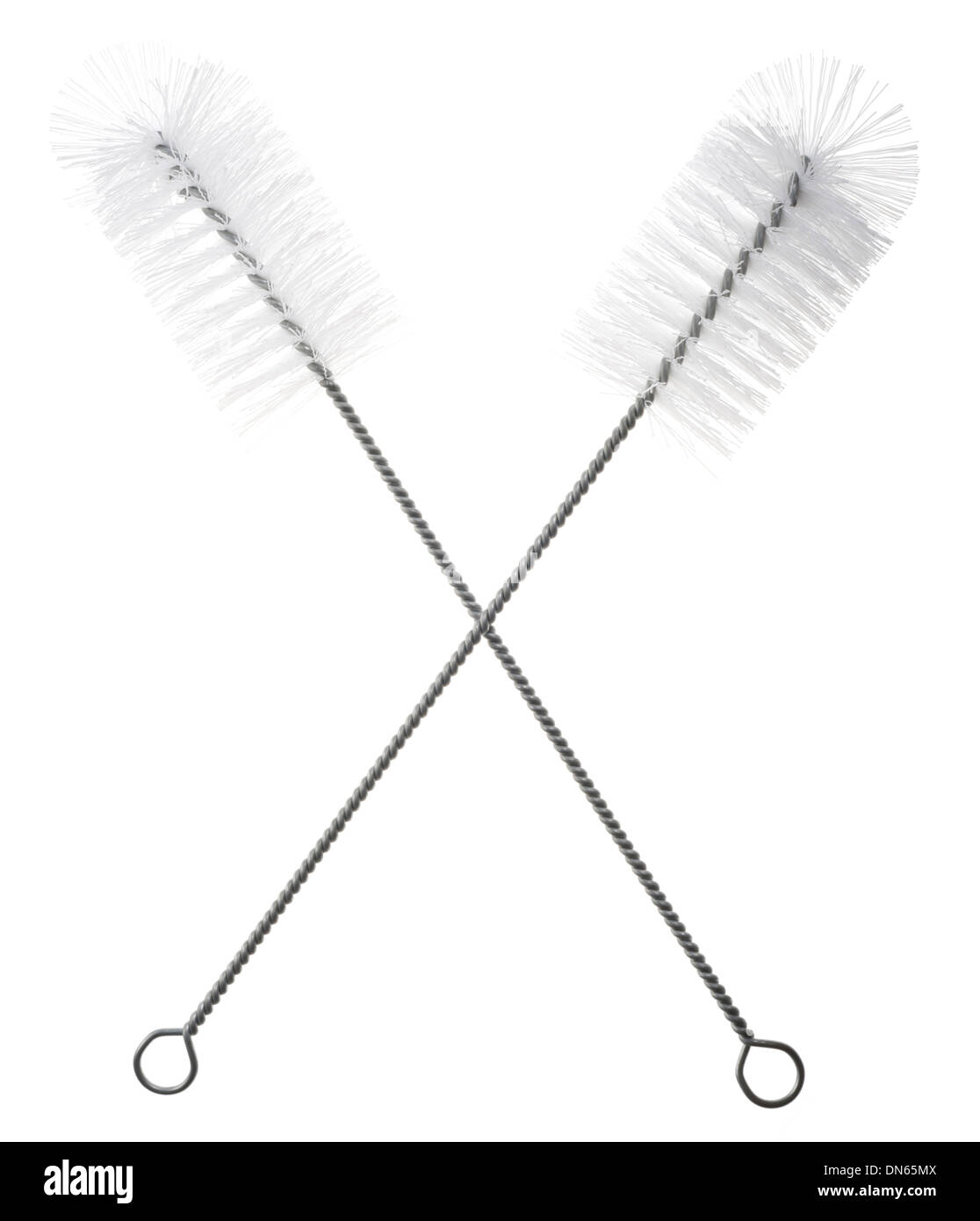 Bottle brushes for cleaning bottles and other tubular items. Pair of brushes together to form an X. Stock Photo