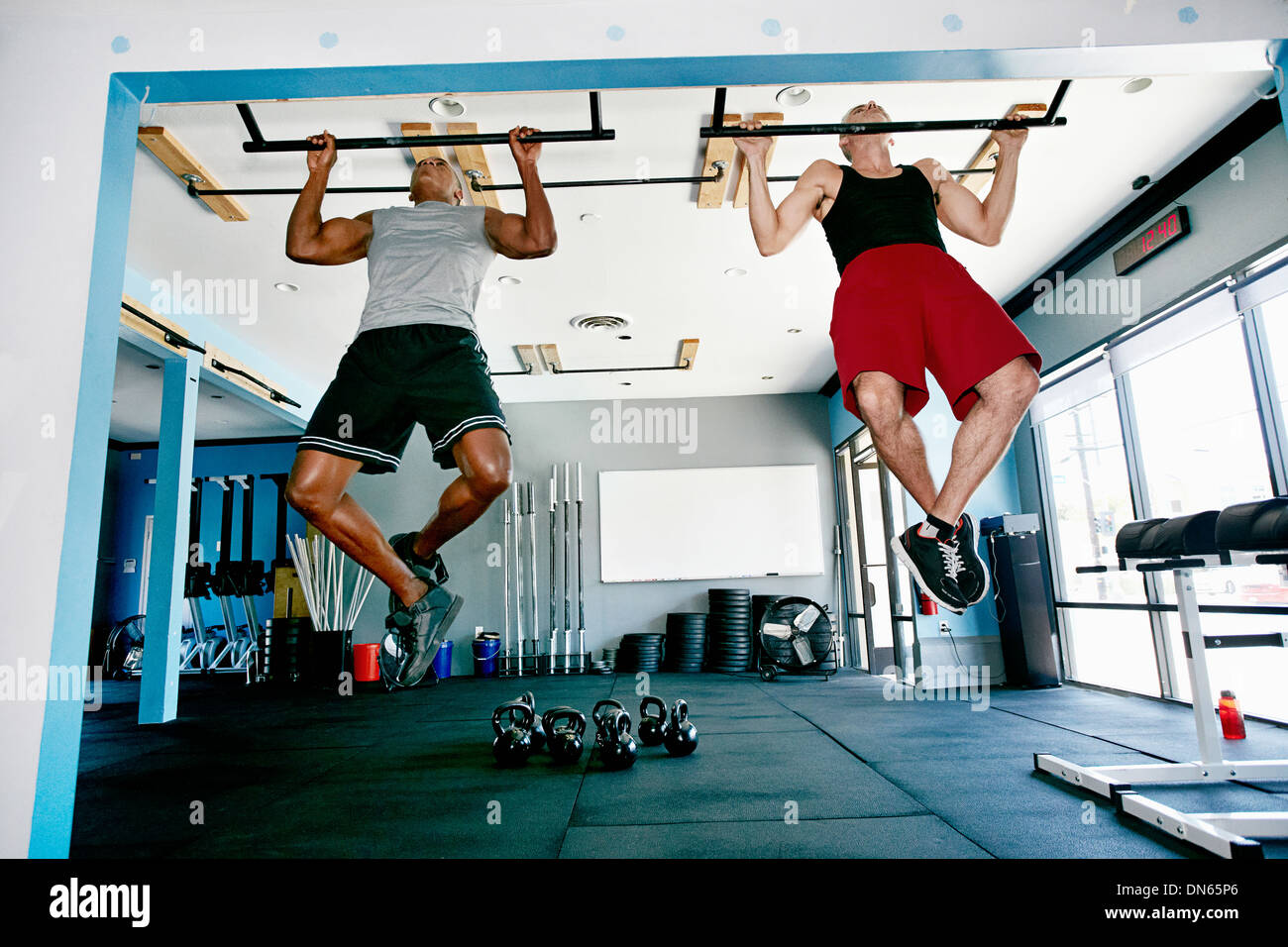 Men working out in gym Stock Photo