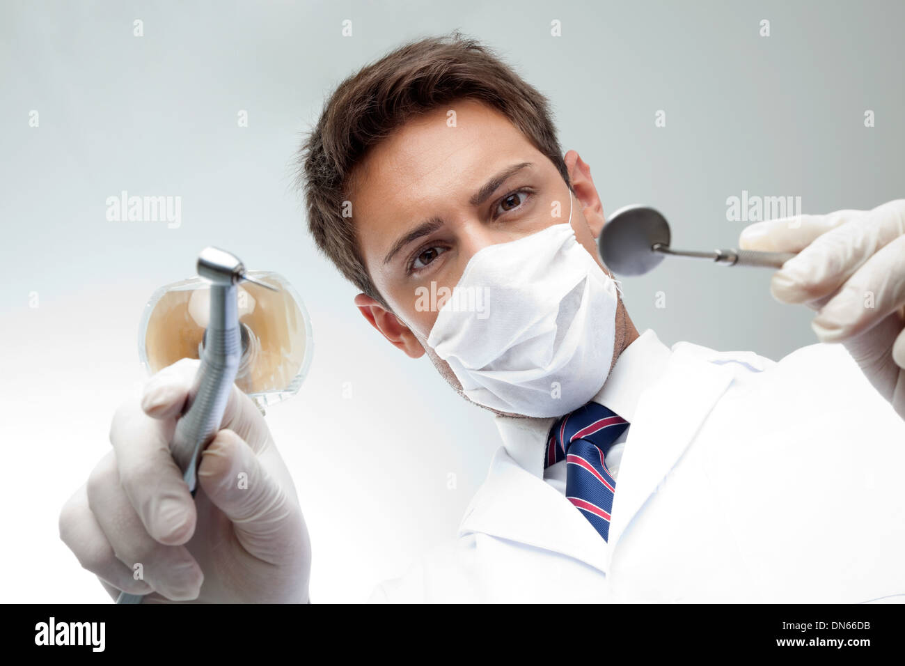 Dentist Holding Angled Mirror And Drill Stock Photo - Alamy