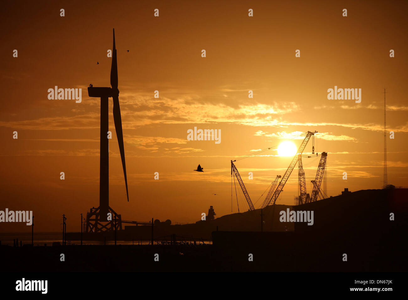 The worlds largest and most powerful offshore wind turbine looms large over the town of Methil, Fife. Stock Photo