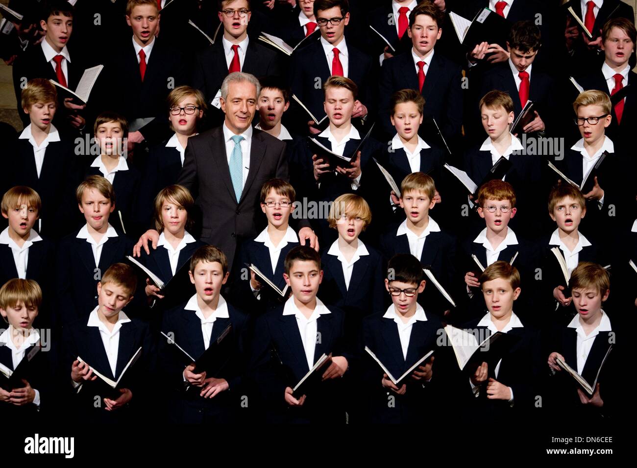 Dresden, Germany. 19th Dec, 2013. The Dresden choirboys surround Saxon's governor Stanislav Tillich during the singing in the Advent's season in the state chancellery in Dresden, Germany, 19 December 2013. Photo: Sebastian Kahnert/dpa/Alamy Live News Stock Photo