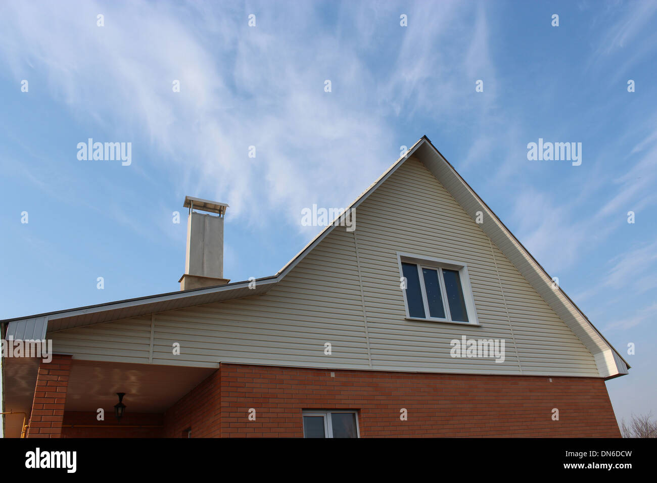 new private modern house on the blue sky background Stock Photo