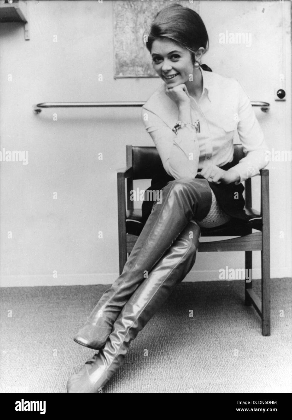Jan. 21, 1969 - Singer WENCKE MYHRE sits in a mini-skirt and over the knee boots. Stock Photo