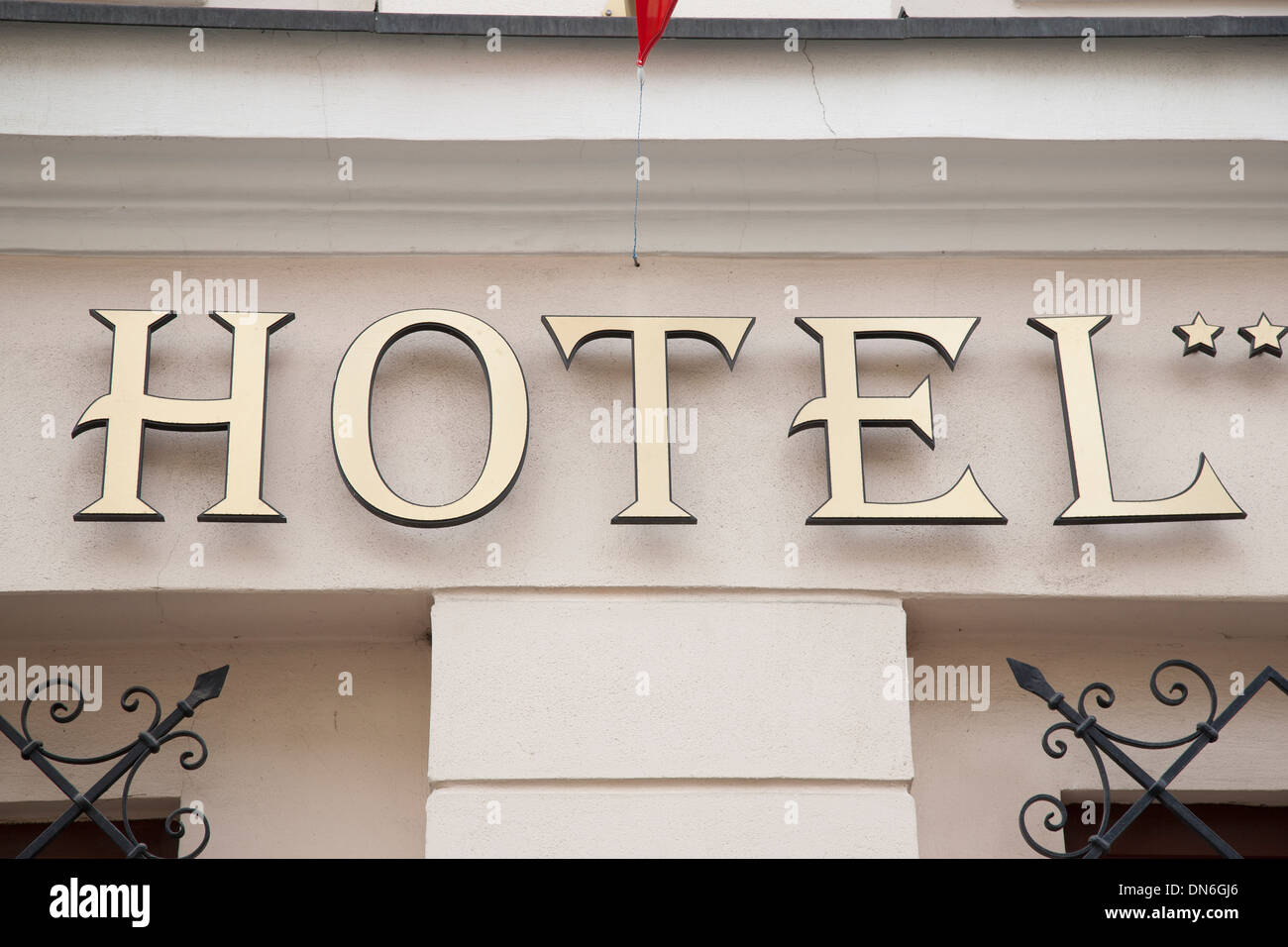 Two Star Hotel Sign on White Stone Wall Stock Photo - Alamy