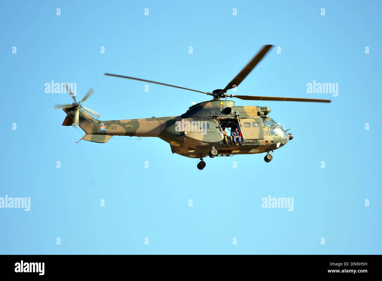A South African military helicopter flying above a protest in Soweto