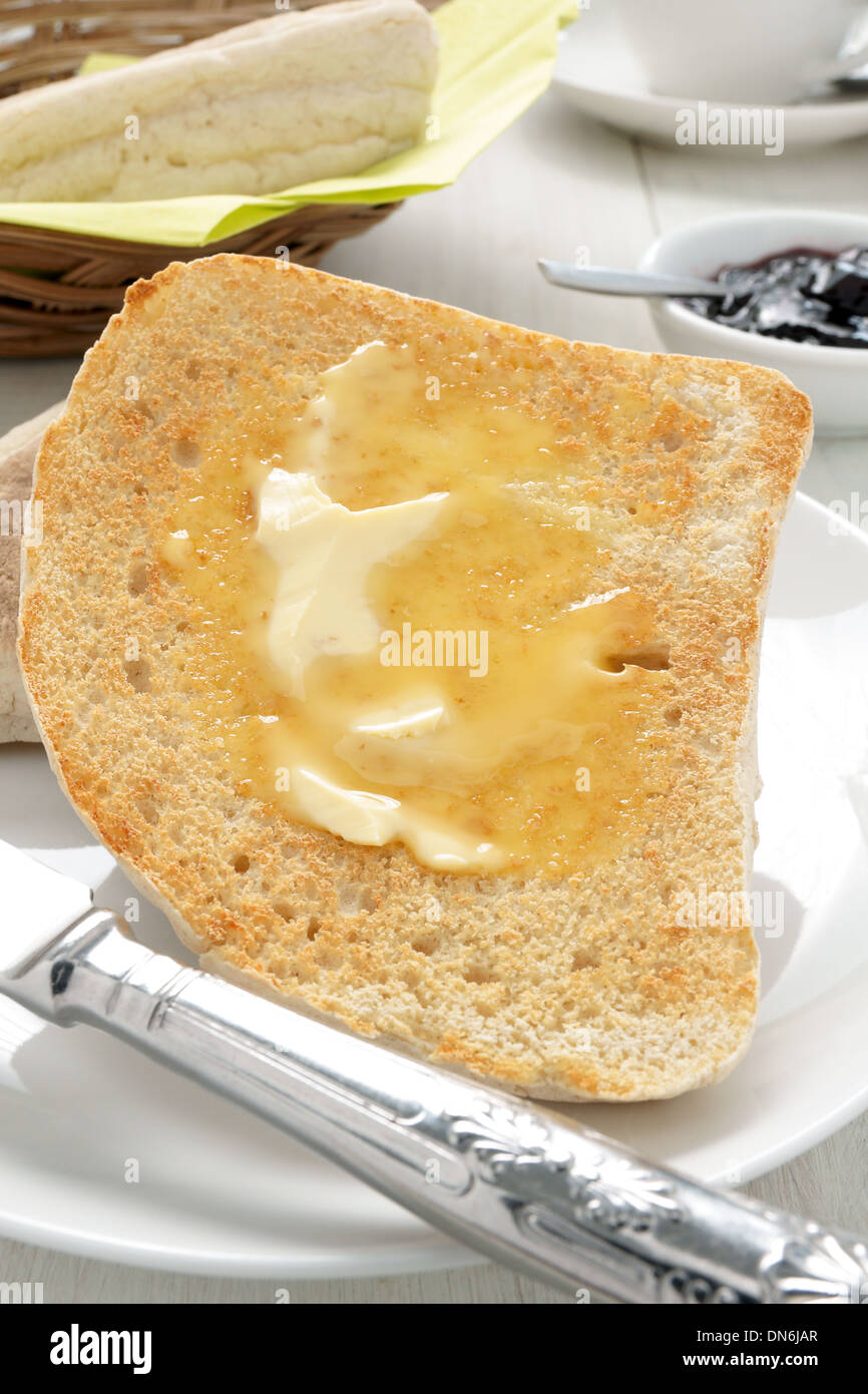 Irish Soda Bread or Farls split and toasted and buttered Stock Photo