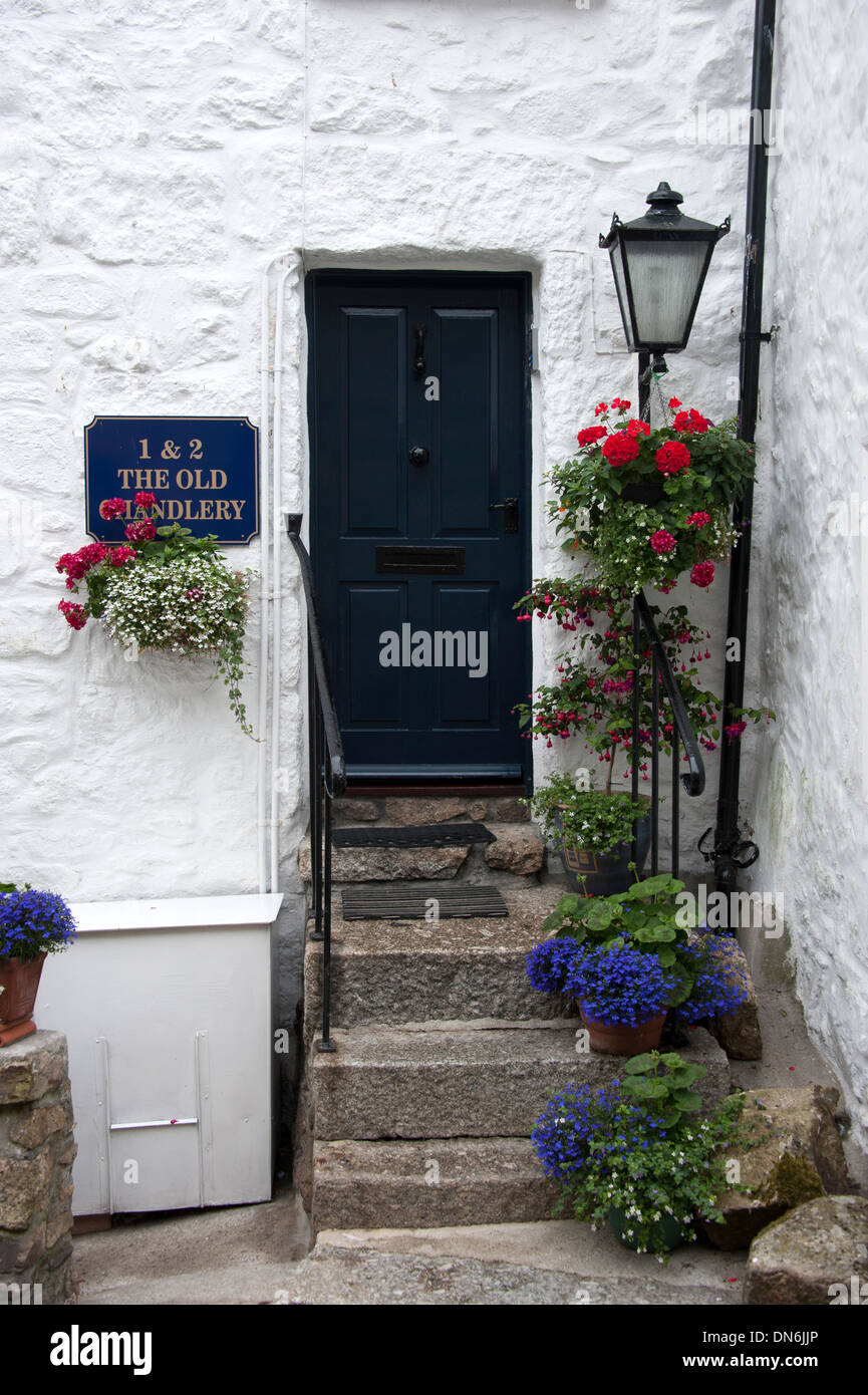 Old Cornish Fishermans Cottage Door Flowers Mousehole Cornwall UK Stock Photo