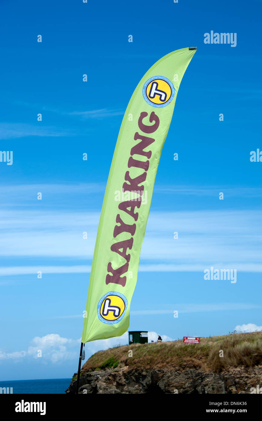 Kayaking banner sign against bright blue sky Stock Photo