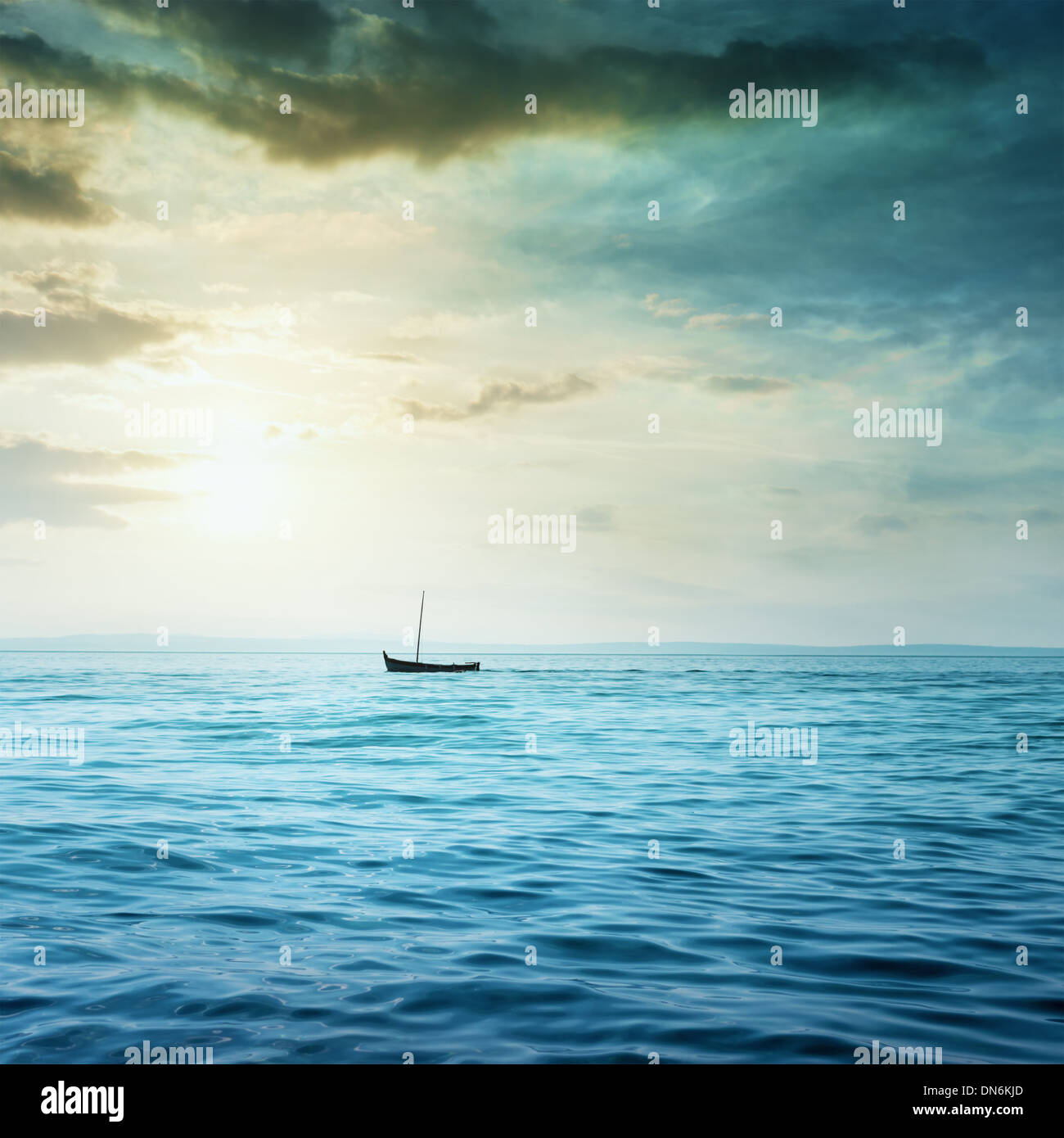 Small boat floats in the sea. Stock Photo