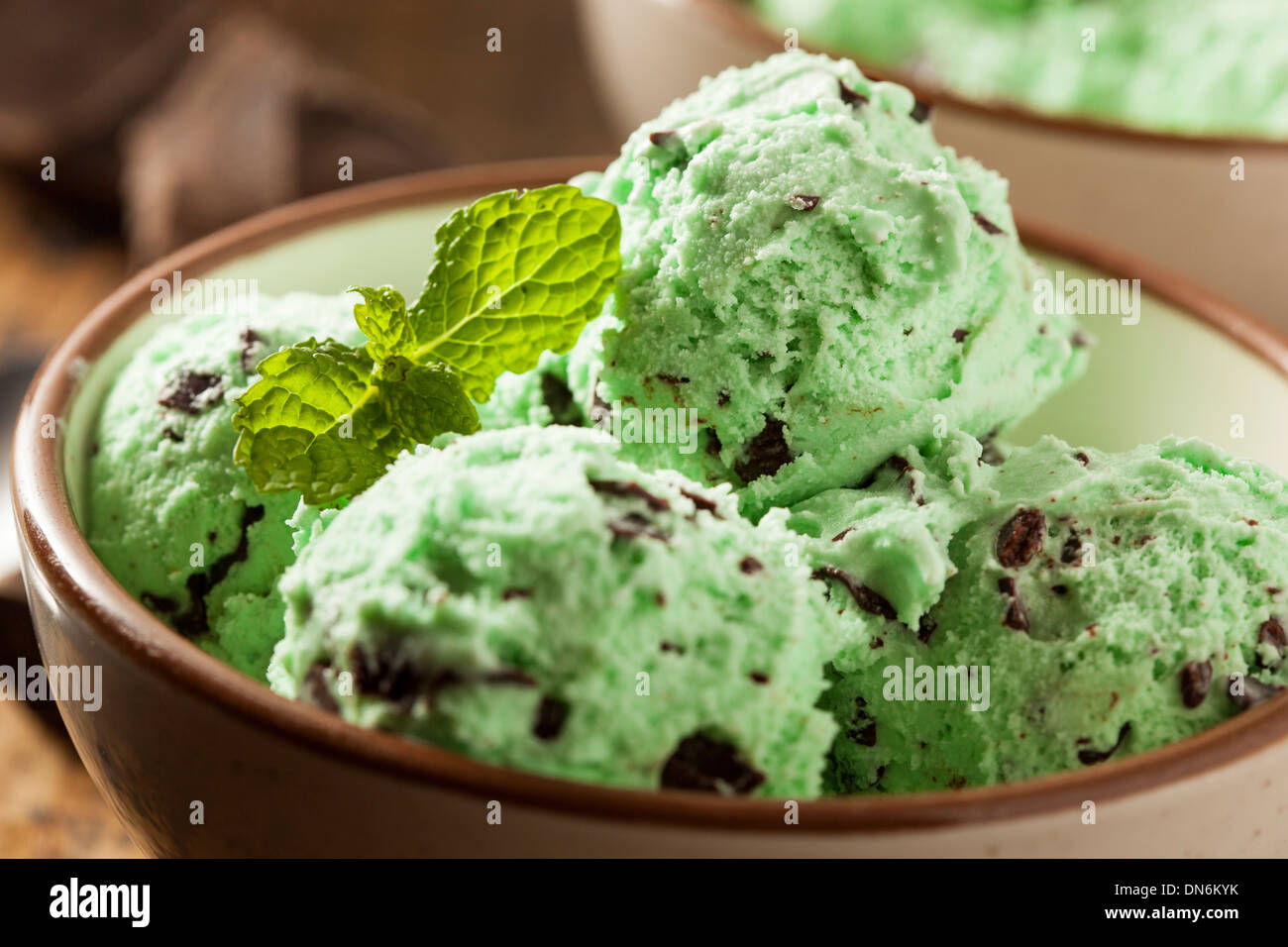 Organic Green Mint Chocolate Chip Ice Cream with a Spoon Stock Photo