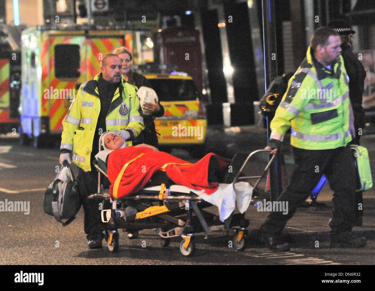 Injured woman on stretcher hi-res stock photography and images - Alamy