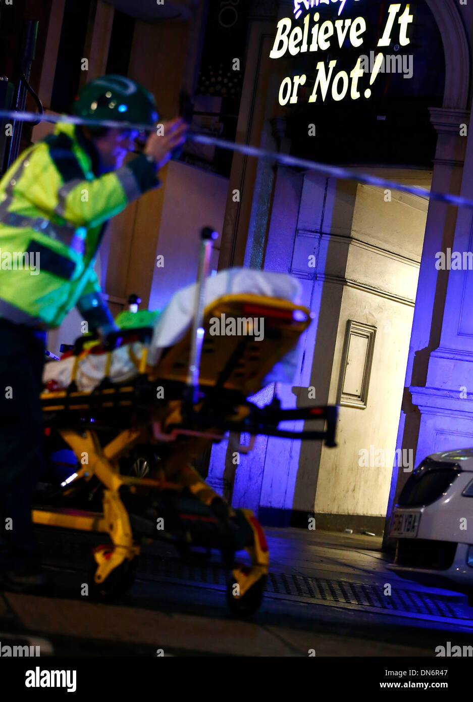 London. 20th Dec, 2013. A rescuer works at the site of a roof collapse at a theatre in central London on Dec. 19, 2013. Some 88 people were injured, including 7 serious cases, after part of the roof in London's Apollo Theatre collapsed on Thursday. Credit:  Yin Gang/Xinhua/Alamy Live News Stock Photo